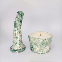 Load image into Gallery viewer, A handmade ceramic massage candle and a 6 inch curved ceramic dildo in a dark green bubble pattern stand in a white photo booth.