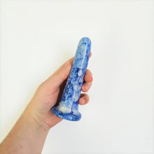 Load image into Gallery viewer, A hand holds a 5 inch classic ceramic dildo in a dark blue and light blue bubble pattern in front of a white background.
